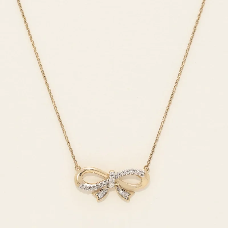 Diamond Bowtie Necklace in Sterling Silver with Yellow Gold Plating (1/10ct tw)